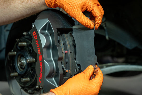 GrimmSpeed Titanium Front Brake Shim Set – 2004–2017 Subaru STI (4-Piston Brembo)